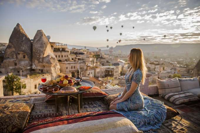 Girl enjoying the stunning view of Cappadocia, Turkey