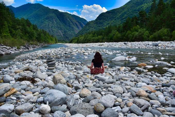 Woman meditating in Rishikesh