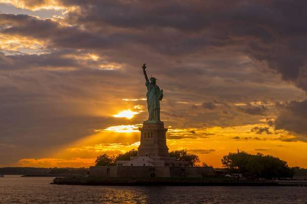 Beautiful Sunset light illuminates Statue Of Liberty