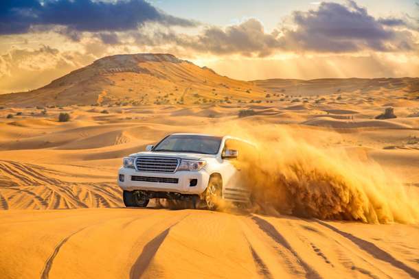Feel the thrill of dune bashing as you conquer the golden sand dunes of the Arabian Desert