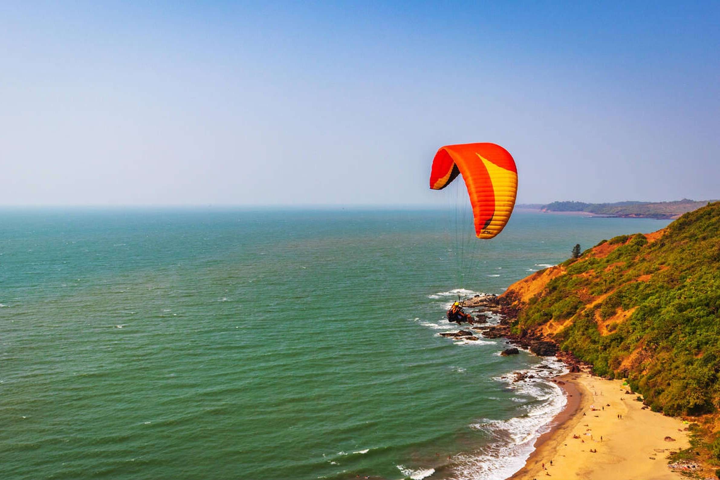 Book Paragliding at Arambol Beach, Goa, and soar above the Arambol Beach 