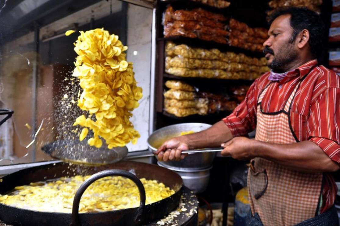 Watch as expert vendors cook banana chips