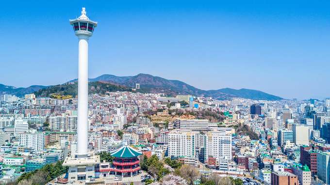 Admire the panoramic view of Busan city from the observatory deck of Busan Tower