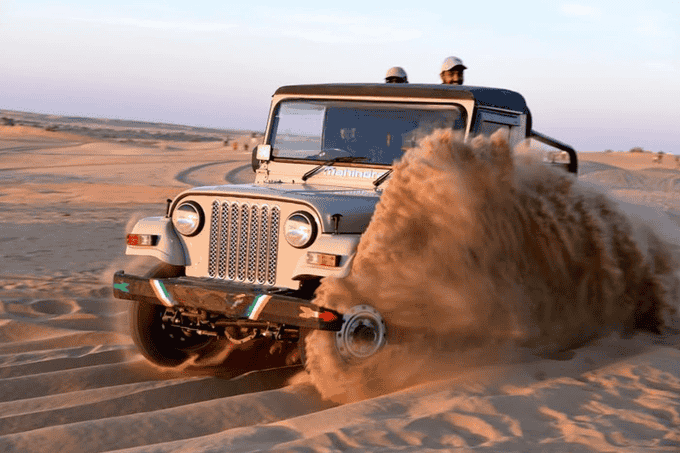 Witness the beauty of endless dunes while enjoying dune bashing in the Thar desert