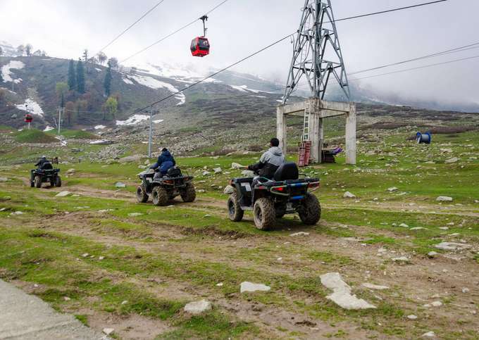 Conquer snowy trails on an exciting ATV ride in Auli