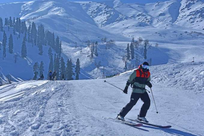 Glide down the slopes of Gulmarg surrounded by breathtaking mountain views