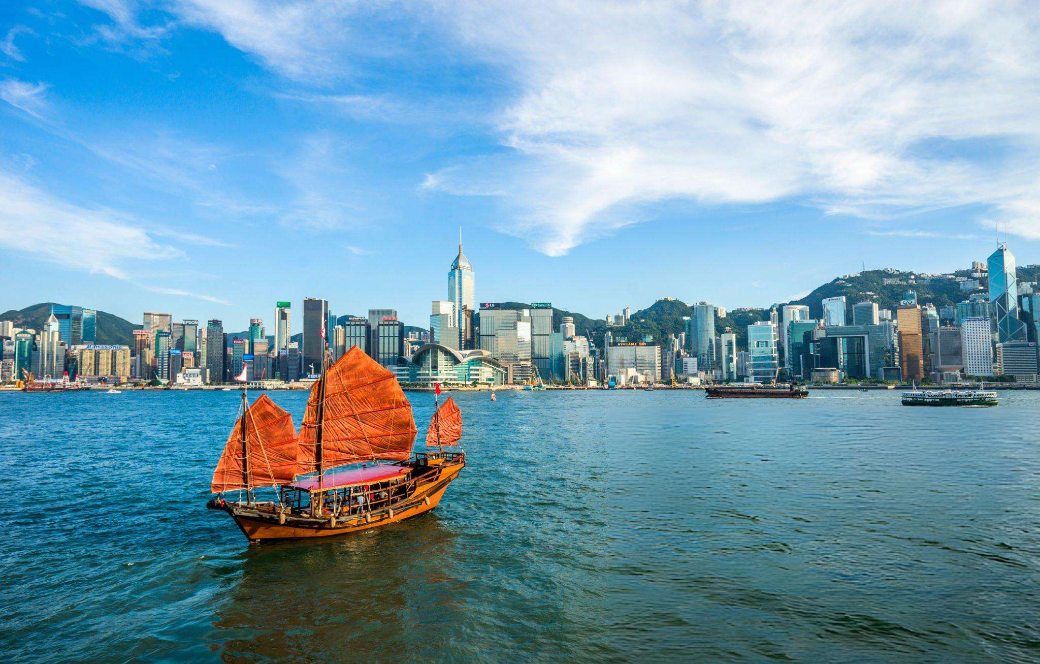 Boat sailing against the stunning skyline of Hong Kong