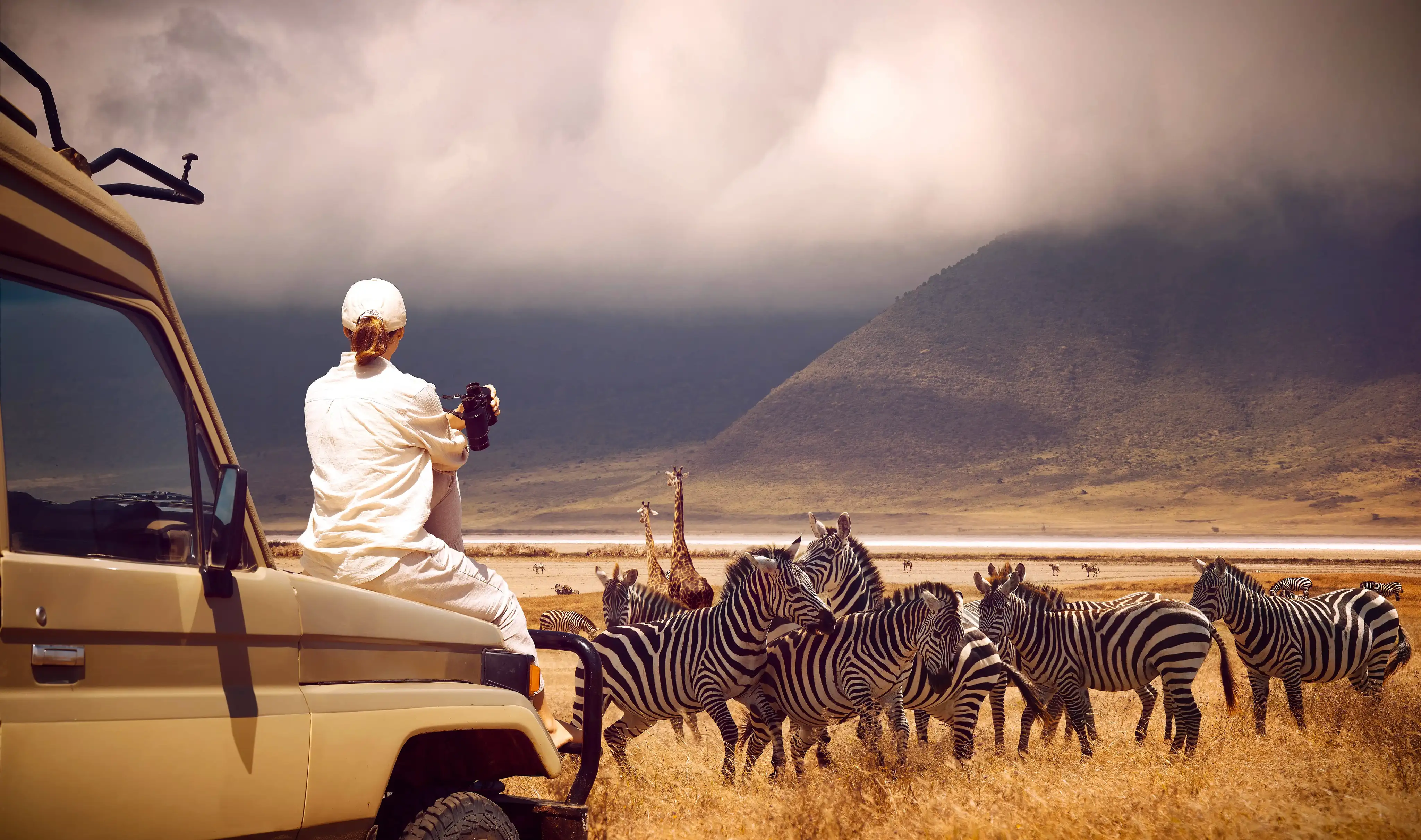 Woman traveler on safari-tour in Africa