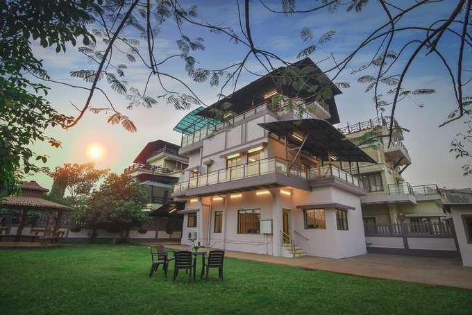 Outside View of villa with lush green garden