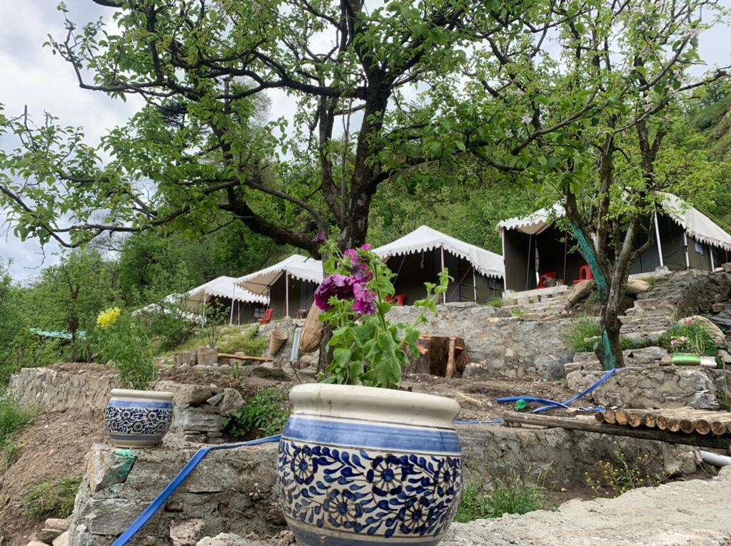 Riverside Camping Rafting and Paragliding Image