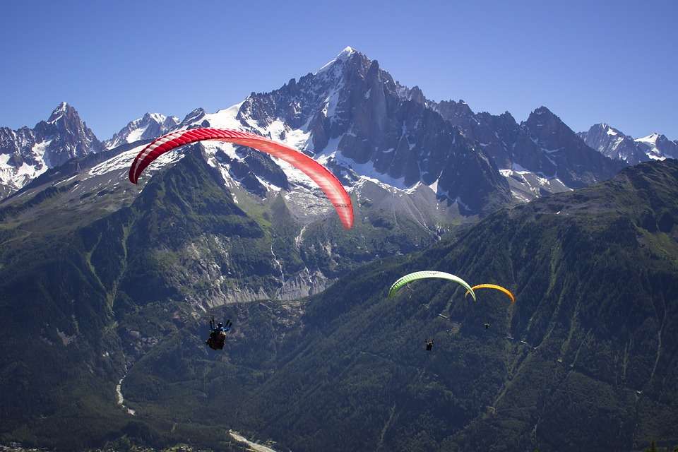 Take in unparalleled views of the majestic peaks that surround you during the paragliding experience