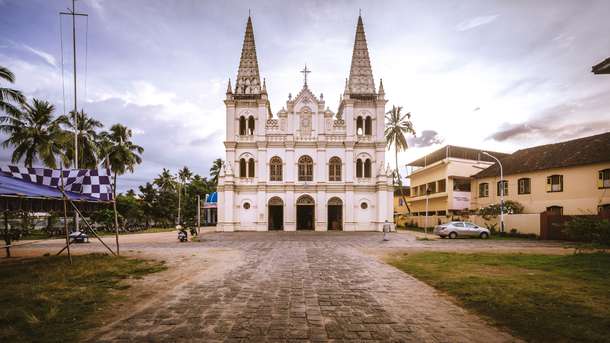 Admire the intricate Gothic architecture and vibrant frescoes of Santa Cruz Cathedral Basilica