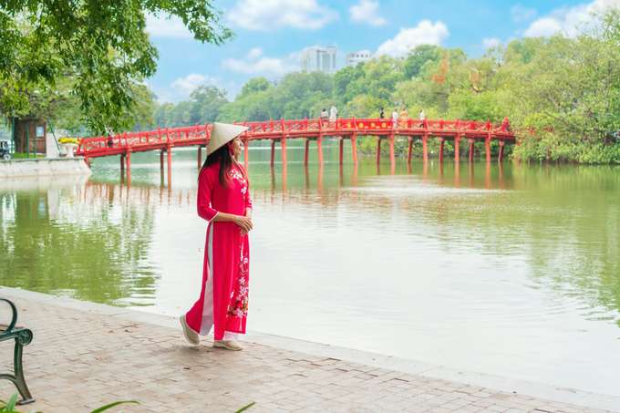 Tourist admiring the beauty of Hoan Keim Lake