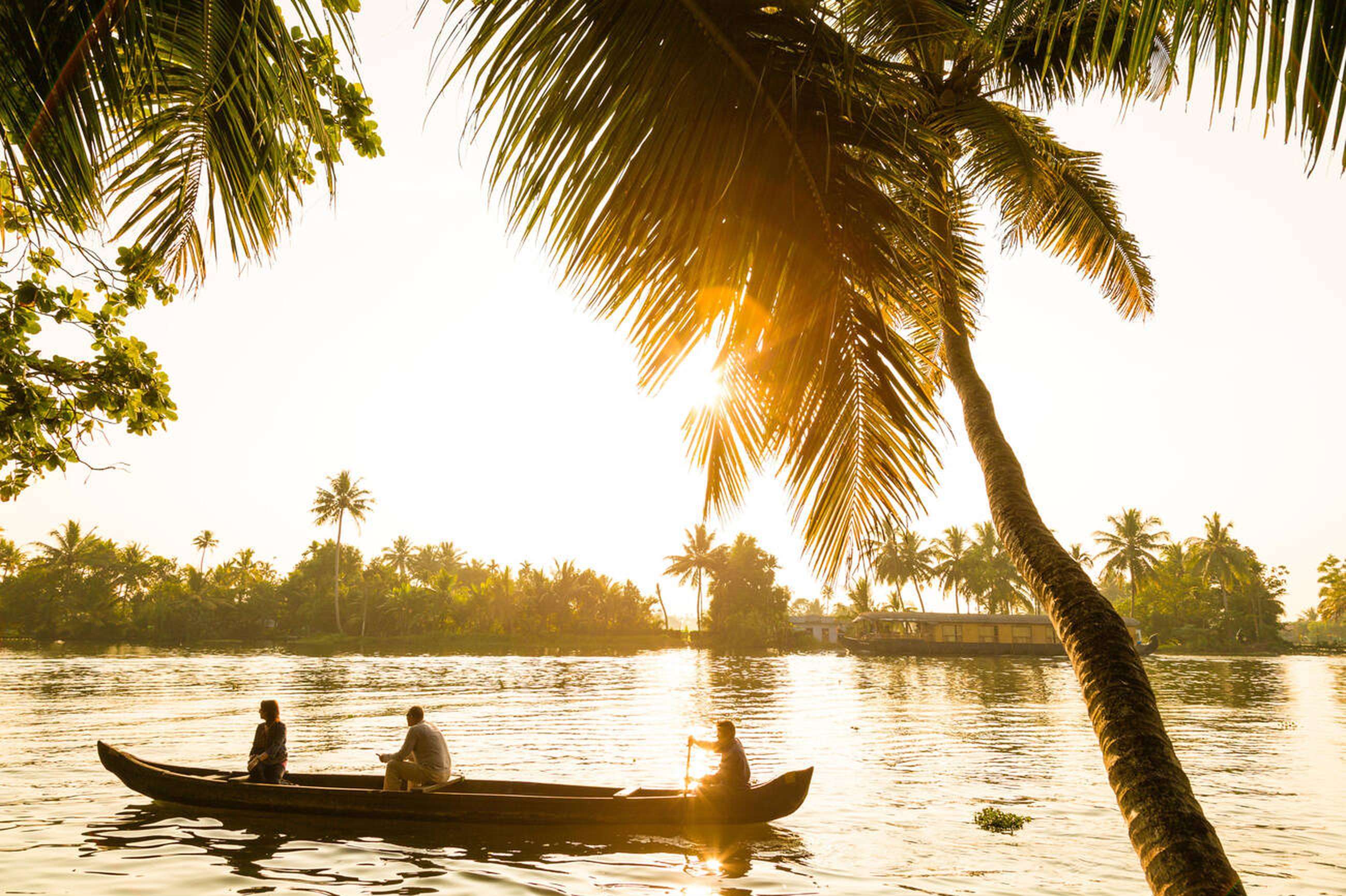 Tourists enjoying boat ride in Alleppey