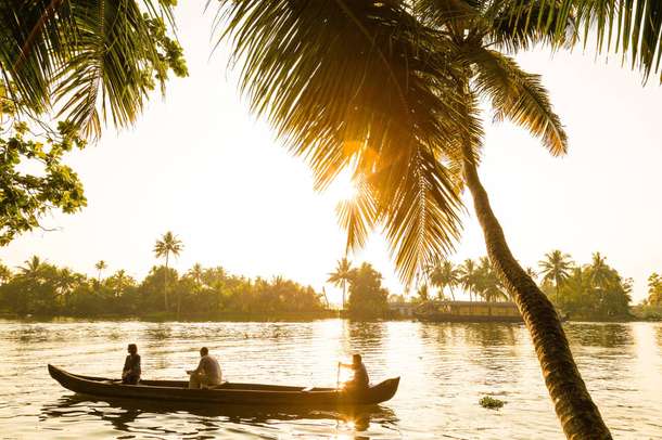 Tourists enjoying boat ride in Alleppey