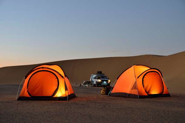 Sleep under the stars in the heart of the Sam Sand Dunes desert