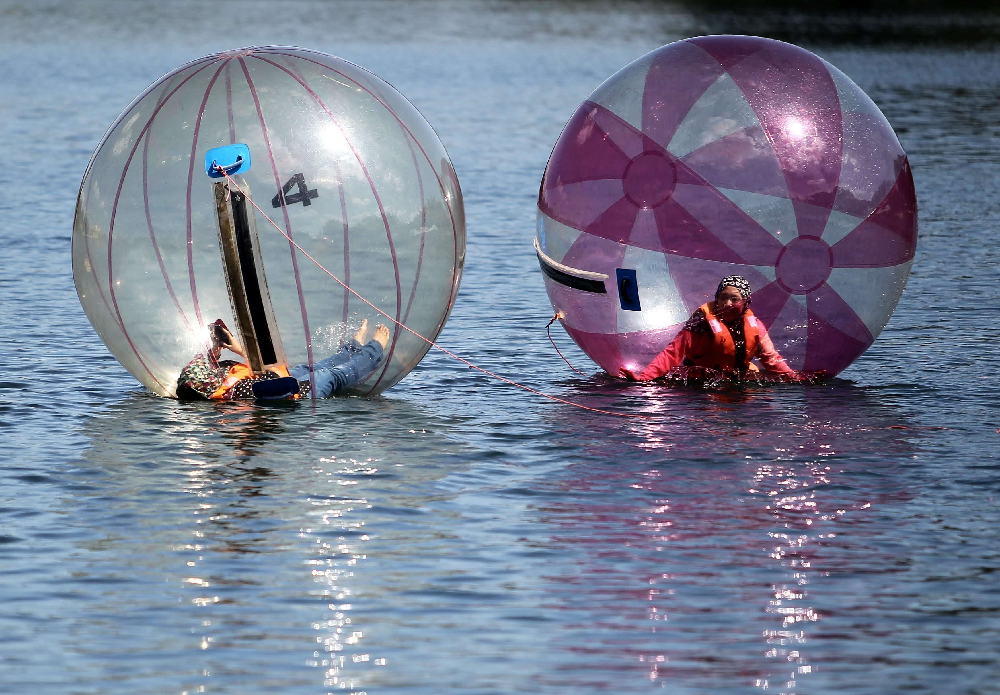 Zorb across calm lake waters in the heart of Rajasthan