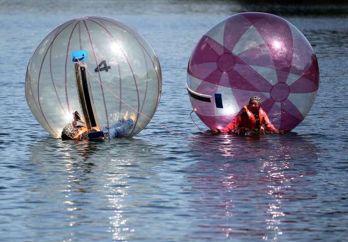Zorb across calm lake waters in the heart of Rajasthan