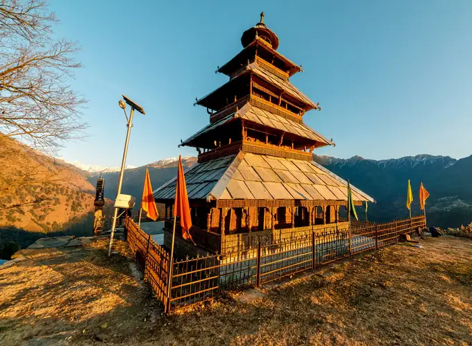 Soak-in the beauty of the Manu Temple surrounded by mountain ranges