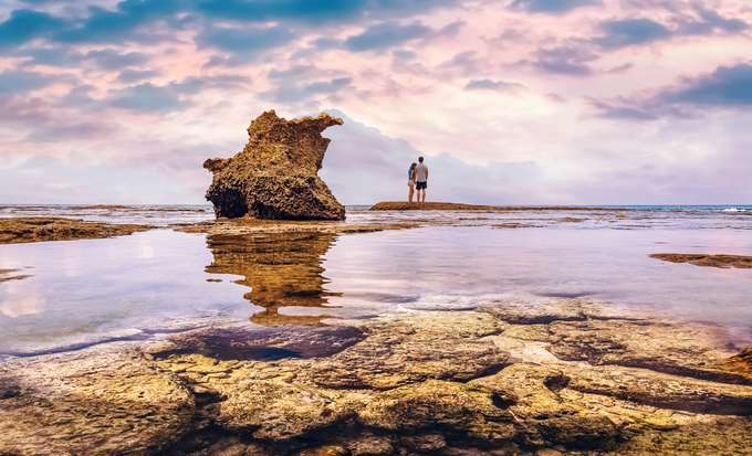 Couple enjoying sunset views at Neil Island