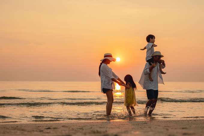 Family enjoying at a beach in Kerala