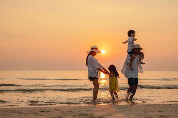 Family enjoying at a beach in Kerala
