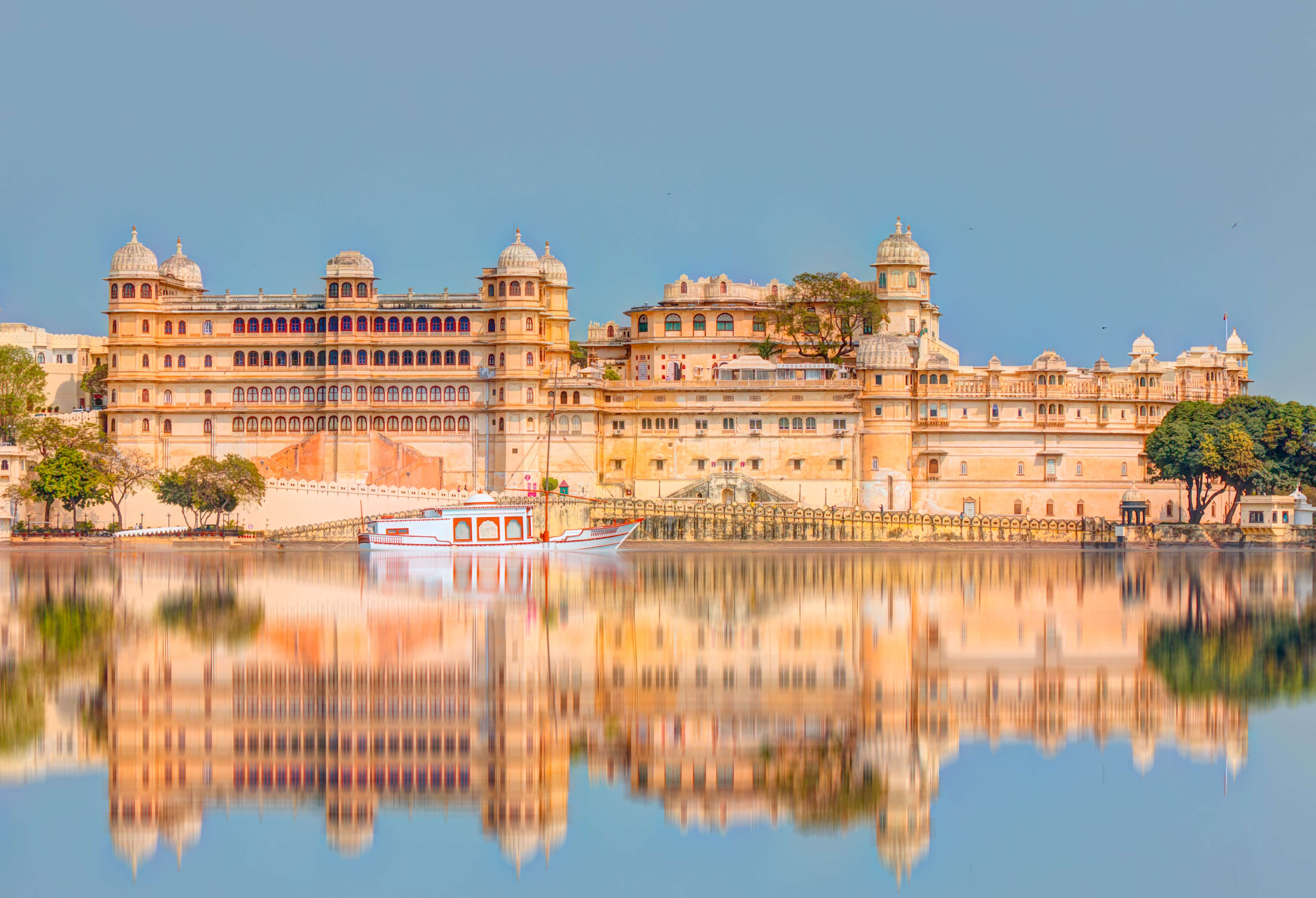 Experience the grandeur of Udaipur's iconic City Palace, standing majestically by Lake Pichola