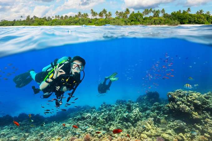 Pose for stunning photographs underwater while you enjoy scuba diving