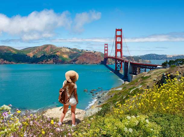 Girl at the famous Golden Gate Bridge San Francisco