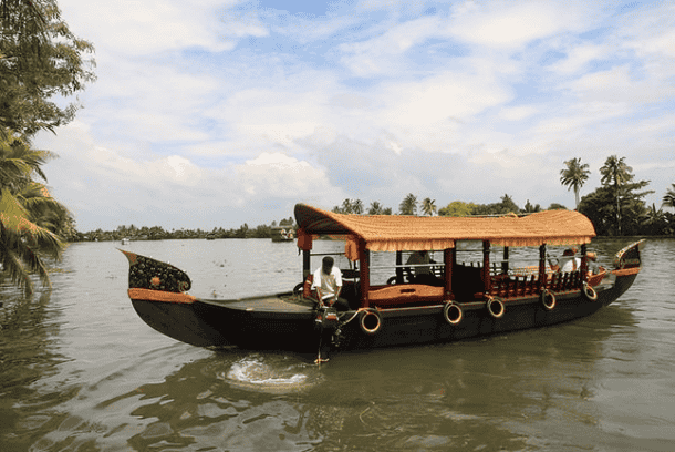 Glide through Poovar’s peaceful backwaters on a scenic shikara ride
