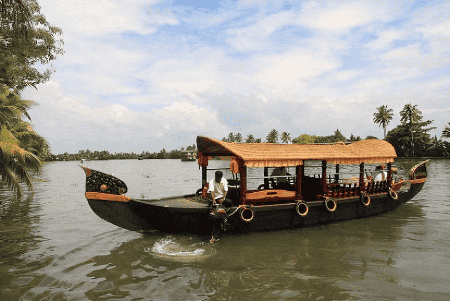 Glide through Poovar’s peaceful backwaters on a scenic shikara ride