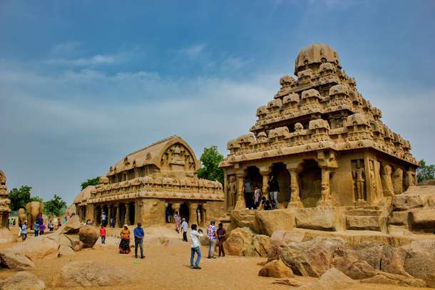 Tourist admiring the archtecture of the Shore temple in Mahabalipuram