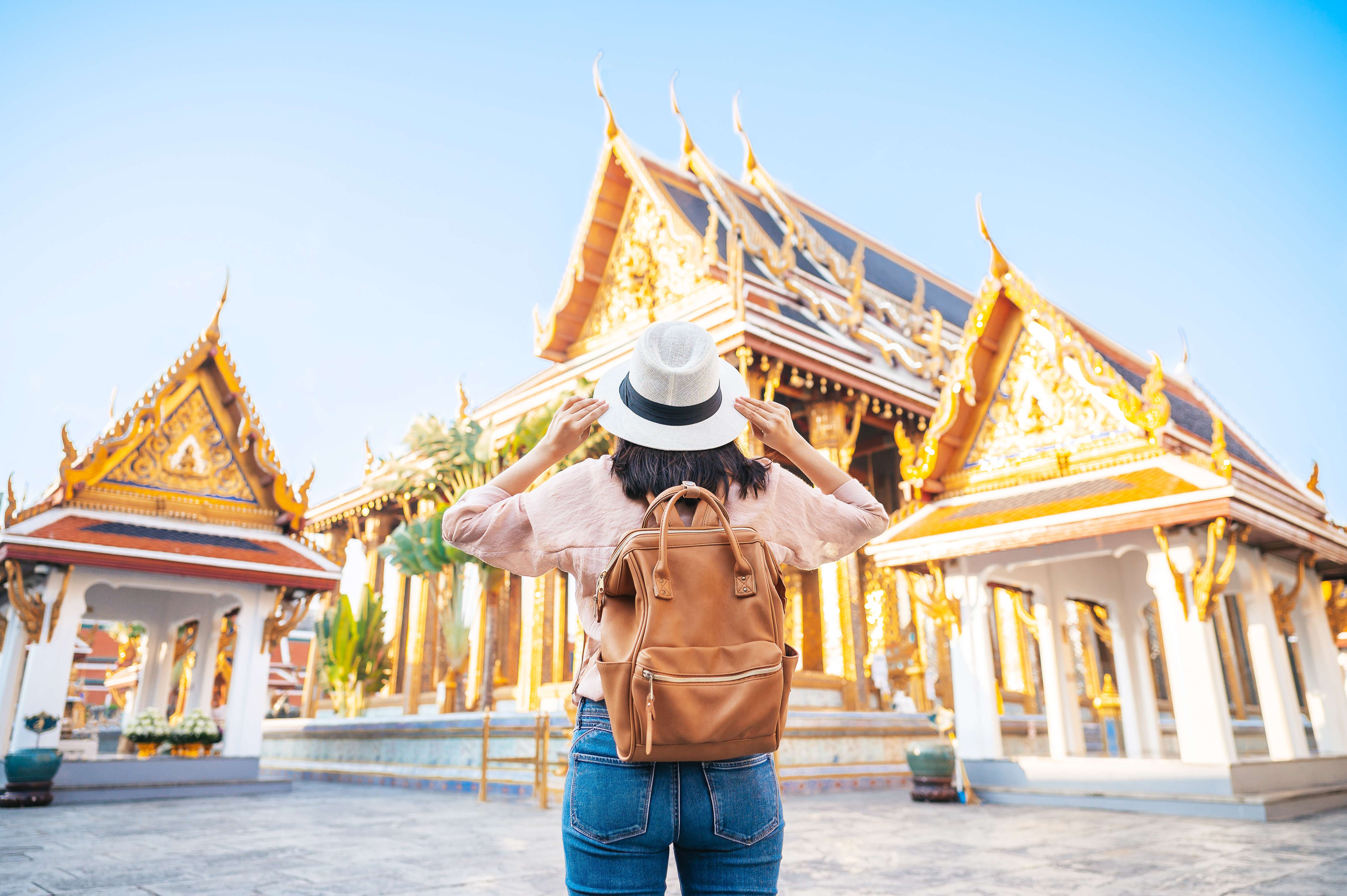 Tourist admiring the beautiful Emerald Buddha Temple