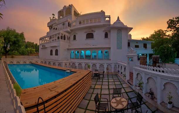 Front view of the property with swimming pool