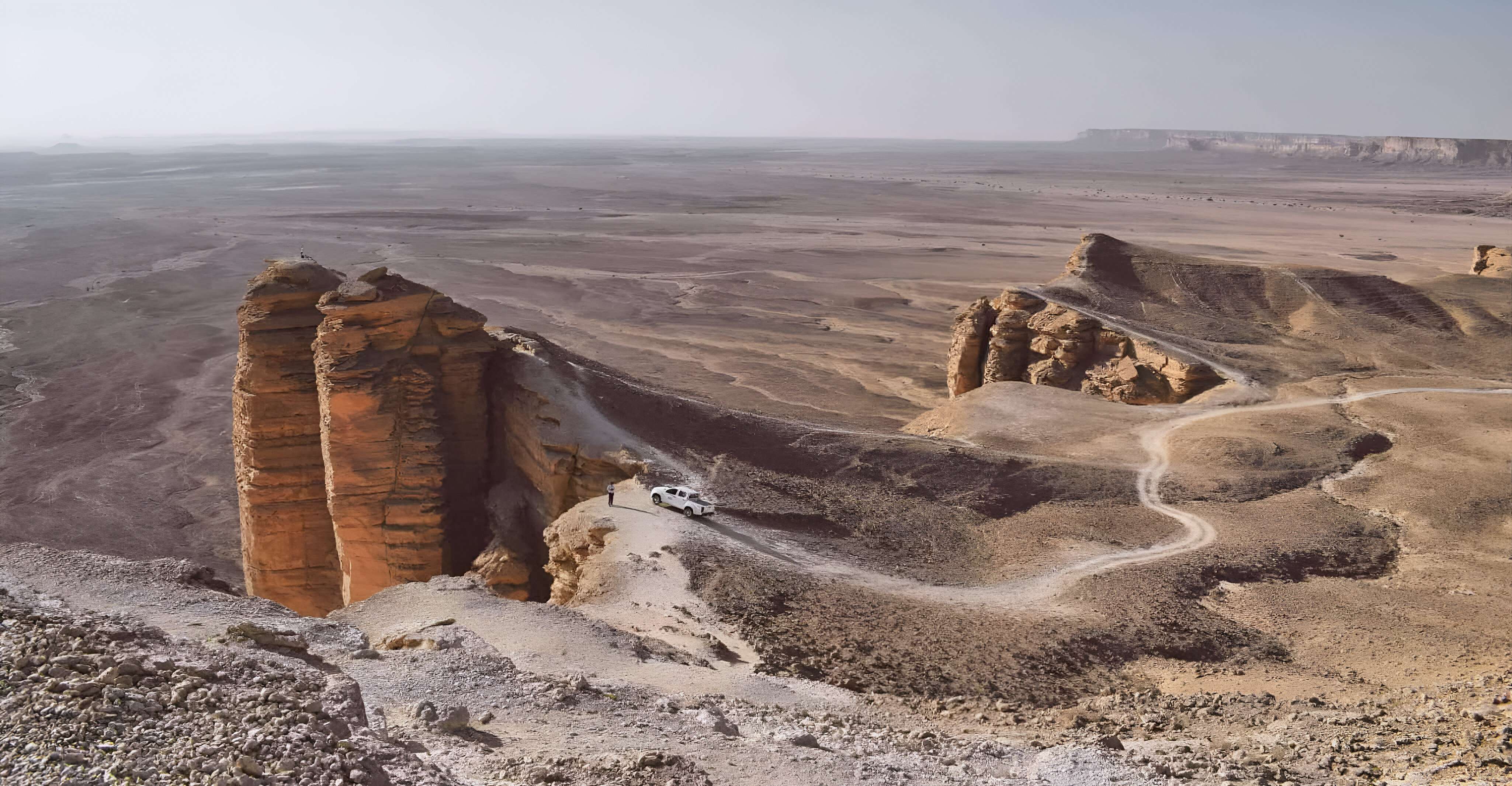 Stand atop towering cliffs and embrace the vastness from Tuwaiq Mountains 