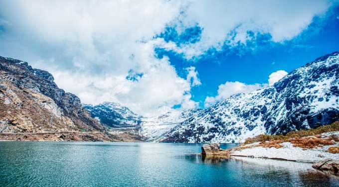 Immerse yourself in the serenity of Tsomgo Lake and gaze at the crystal-clear waters