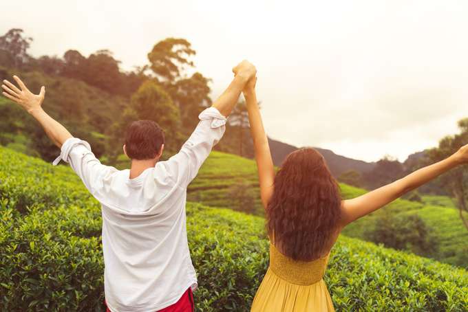 Couple enjoying in the lush green hills of Munnar