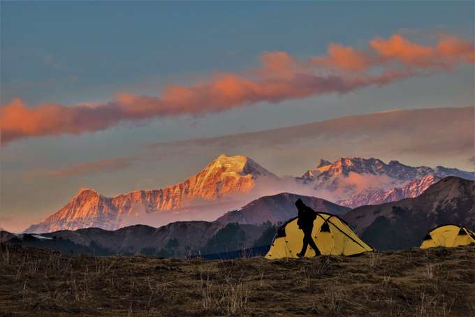Camp at Gui & witness a sunset that paints the entire place in the brightest shade of red and orange