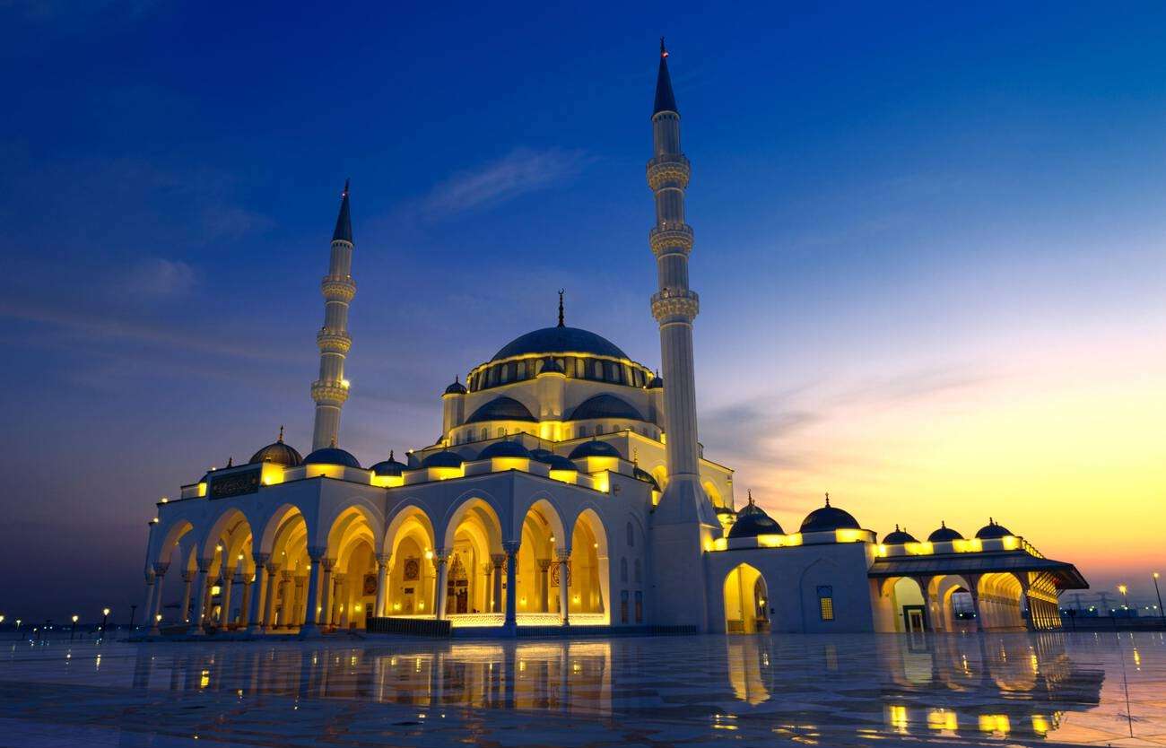 Admire the grand architecture of the Sharjah Grand Mosque, one of the UAE’s largest mosques