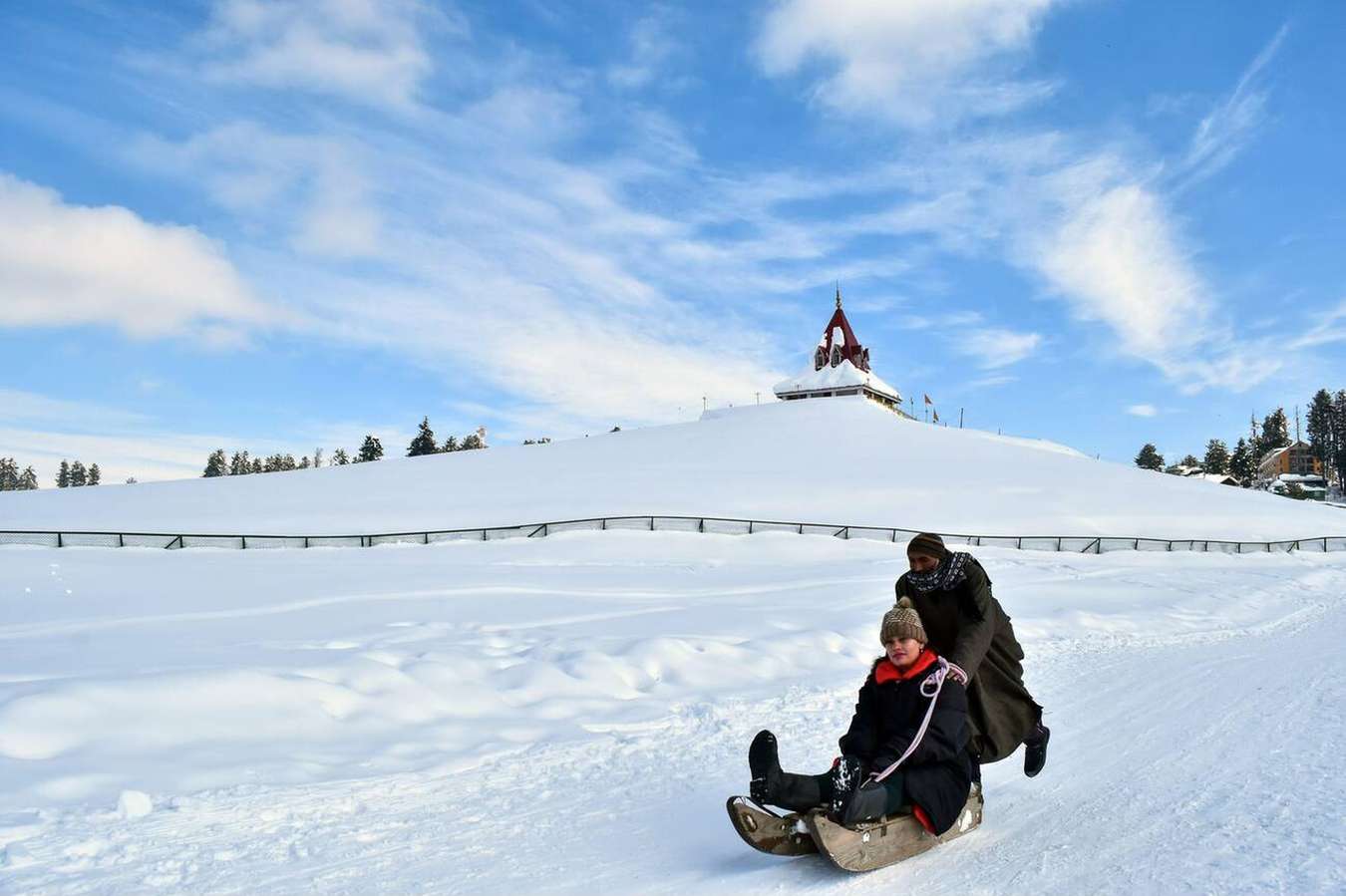 Let the soft snow beneath your sledge transport you to a serene winter paradise in the heart of Gulmarg