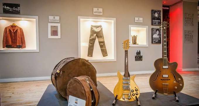 See the instruments, attire, and music The Beatles produced