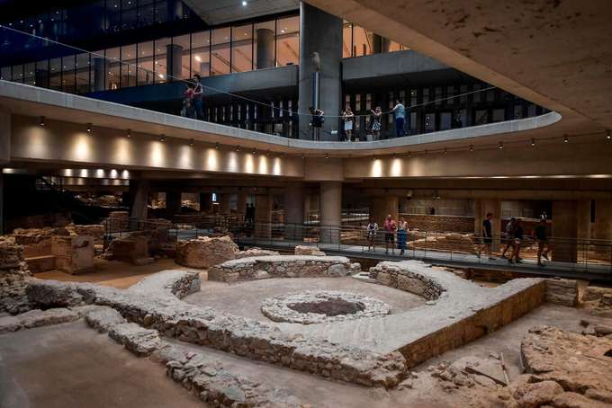 Look at the archaeological excavation in the museum