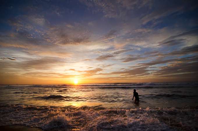 Walk along Marina Beach as the sun paints the sky.