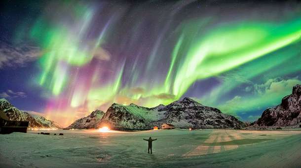 Tourist enjoying the view of Northern Lights