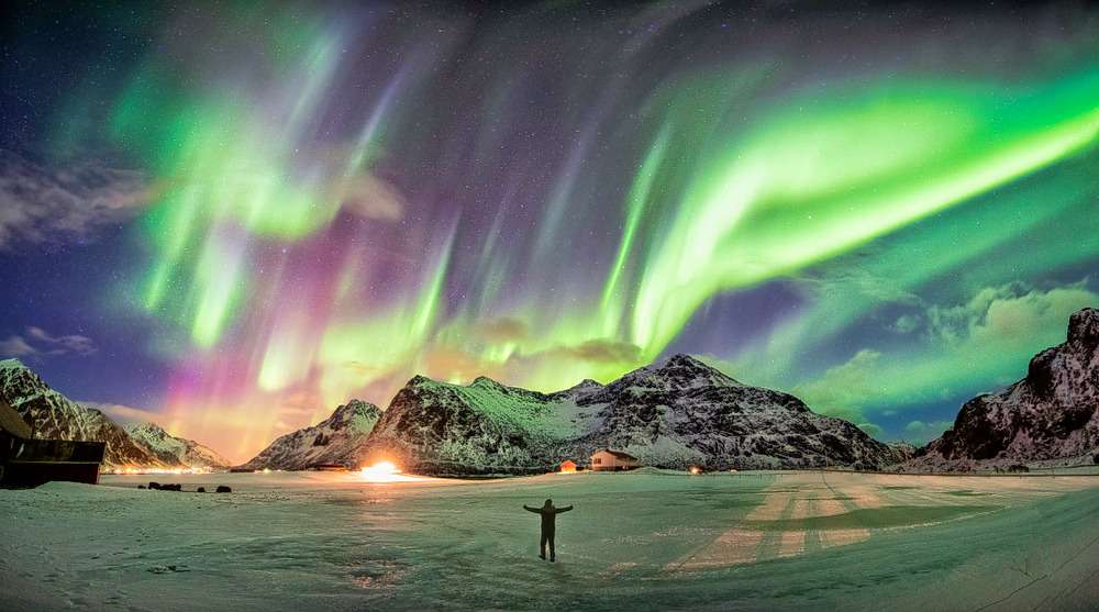 Tourist enjoying the view of Northern Lights