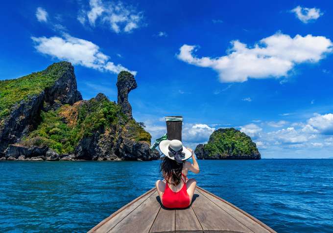 Sail to Chicken Island, known for its turquoise waters and white beaches