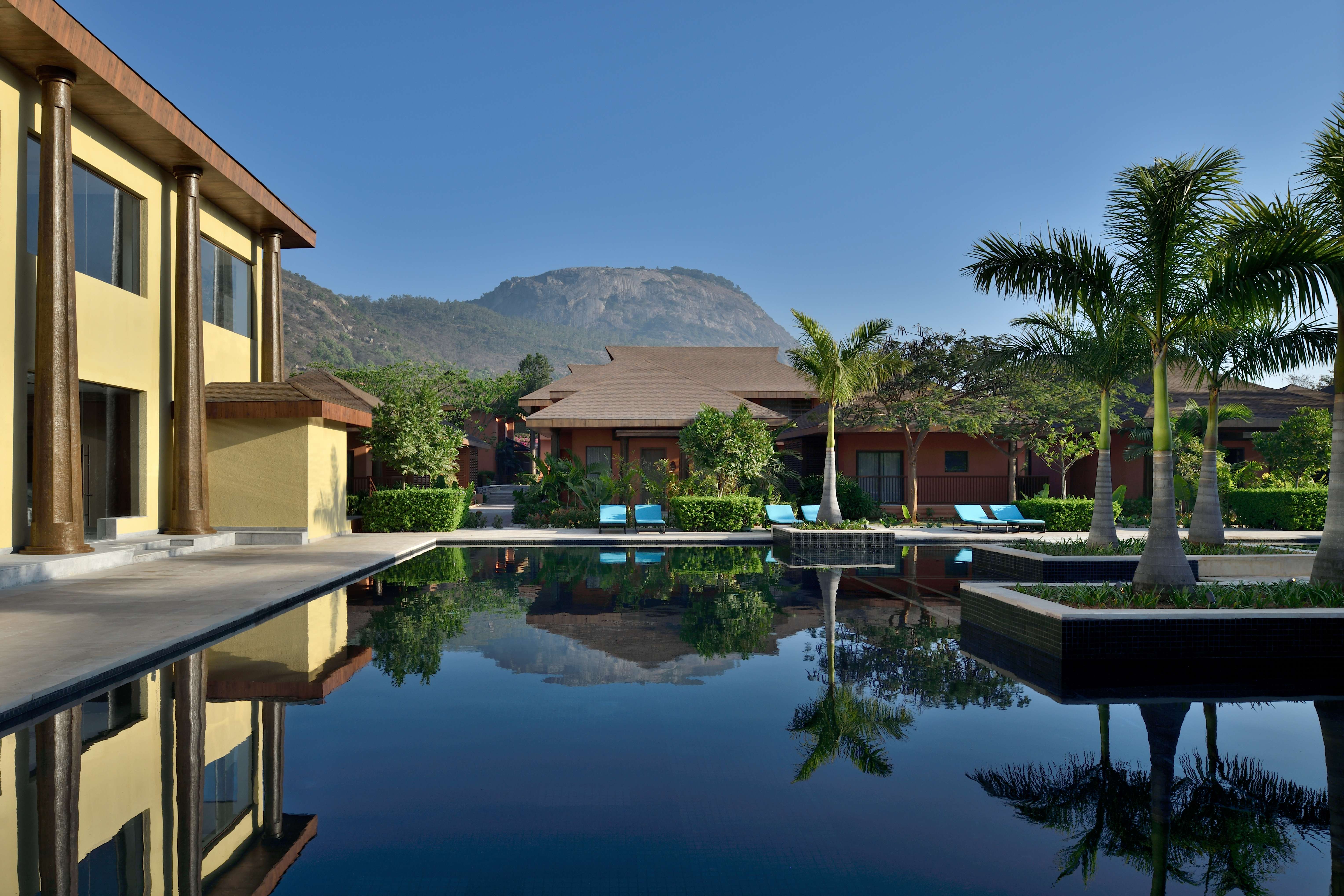 Take a relaxing dip inside the pool with a beautiful backdrop of Nandi hills