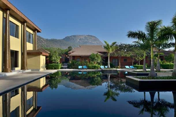 Take a relaxing dip inside the pool with a beautiful backdrop of Nandi hills