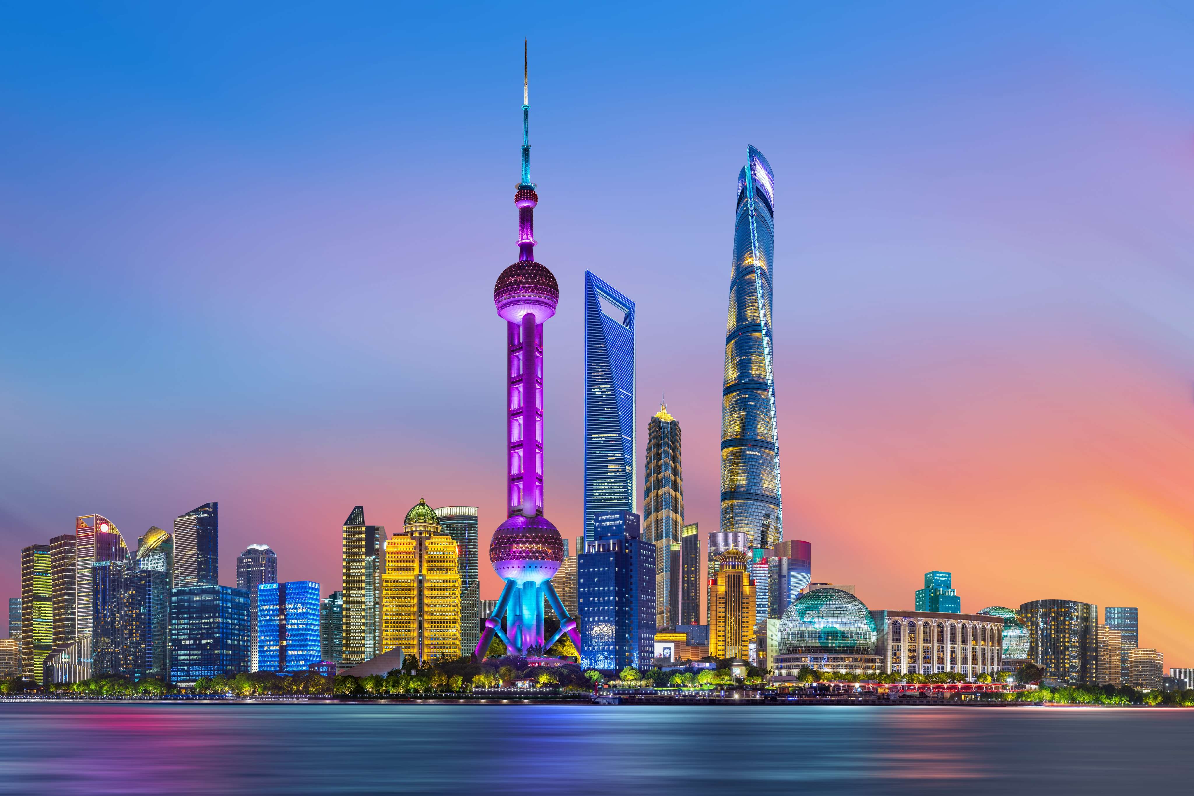 Gaze at Shanghai’s dazzling skyline, lit up in vibrant neon hues