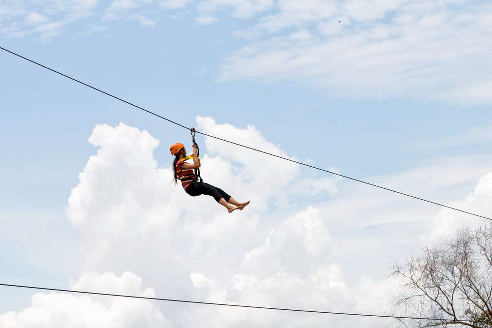 Glide 150 meters across Coorg’s lush forests, enjoying a thrilling zip-lining experience